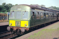Green Class 101 DMU with yellow panel and yellow first class stripe