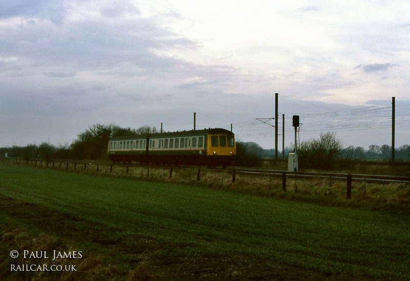 Class 114 DMU at Maxey Level Crossing